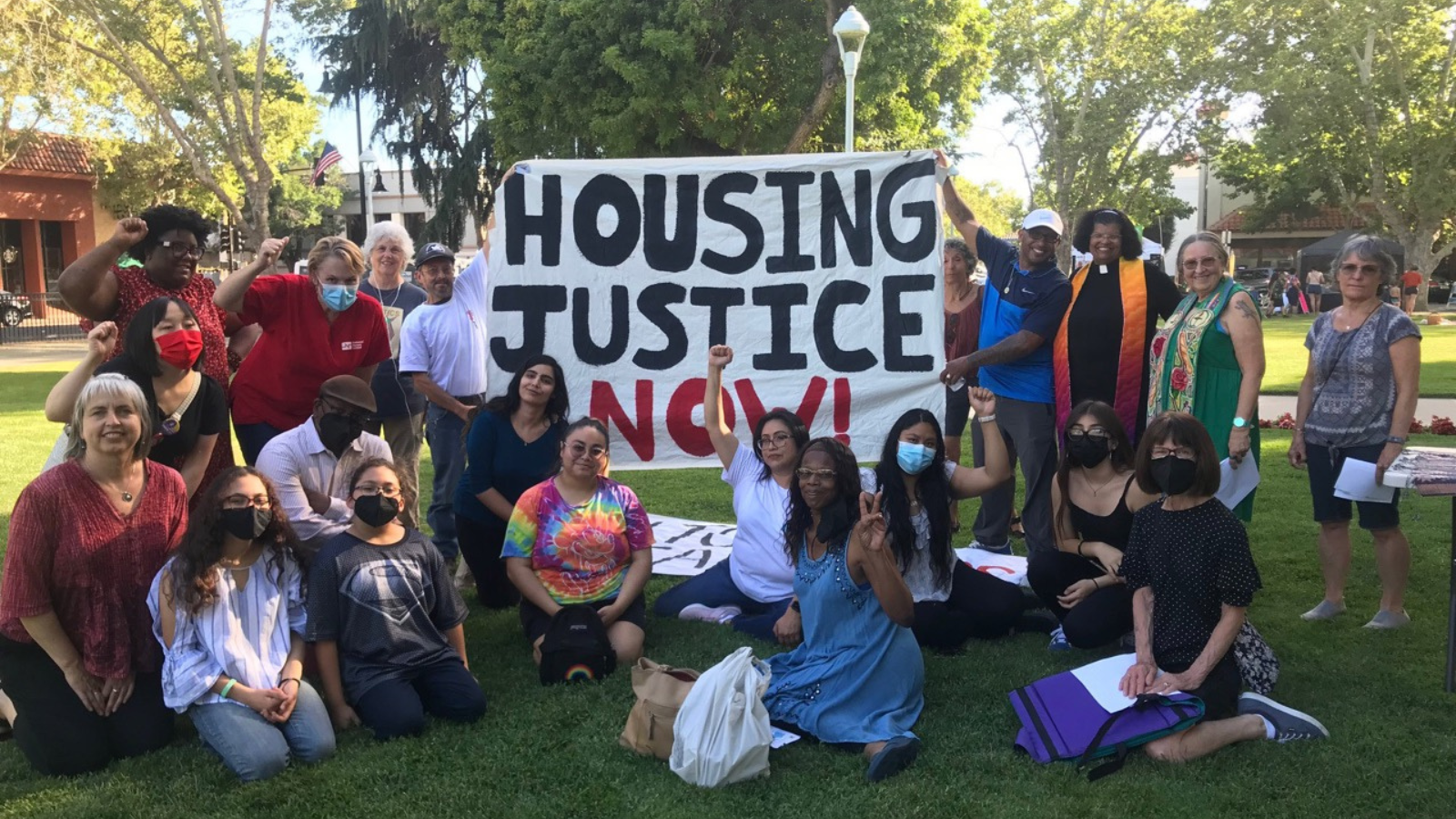 a group of people holding signs