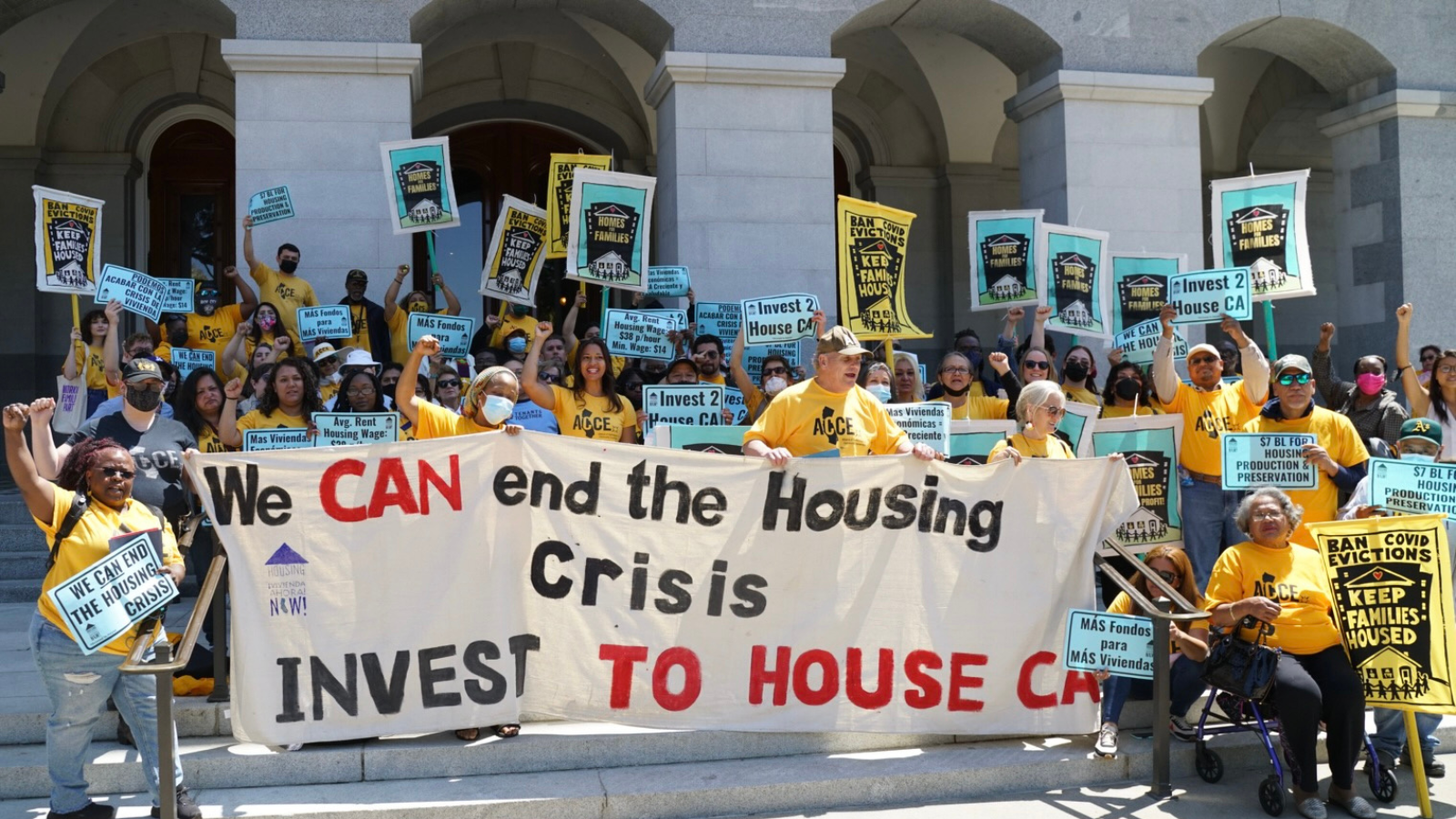 a group of people holding signs